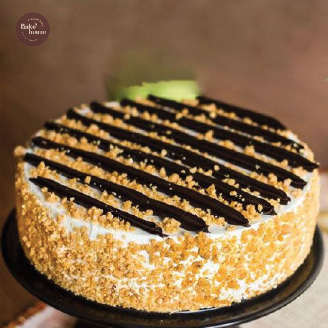 Butterscotch cake with chocolate batons and praline crumb